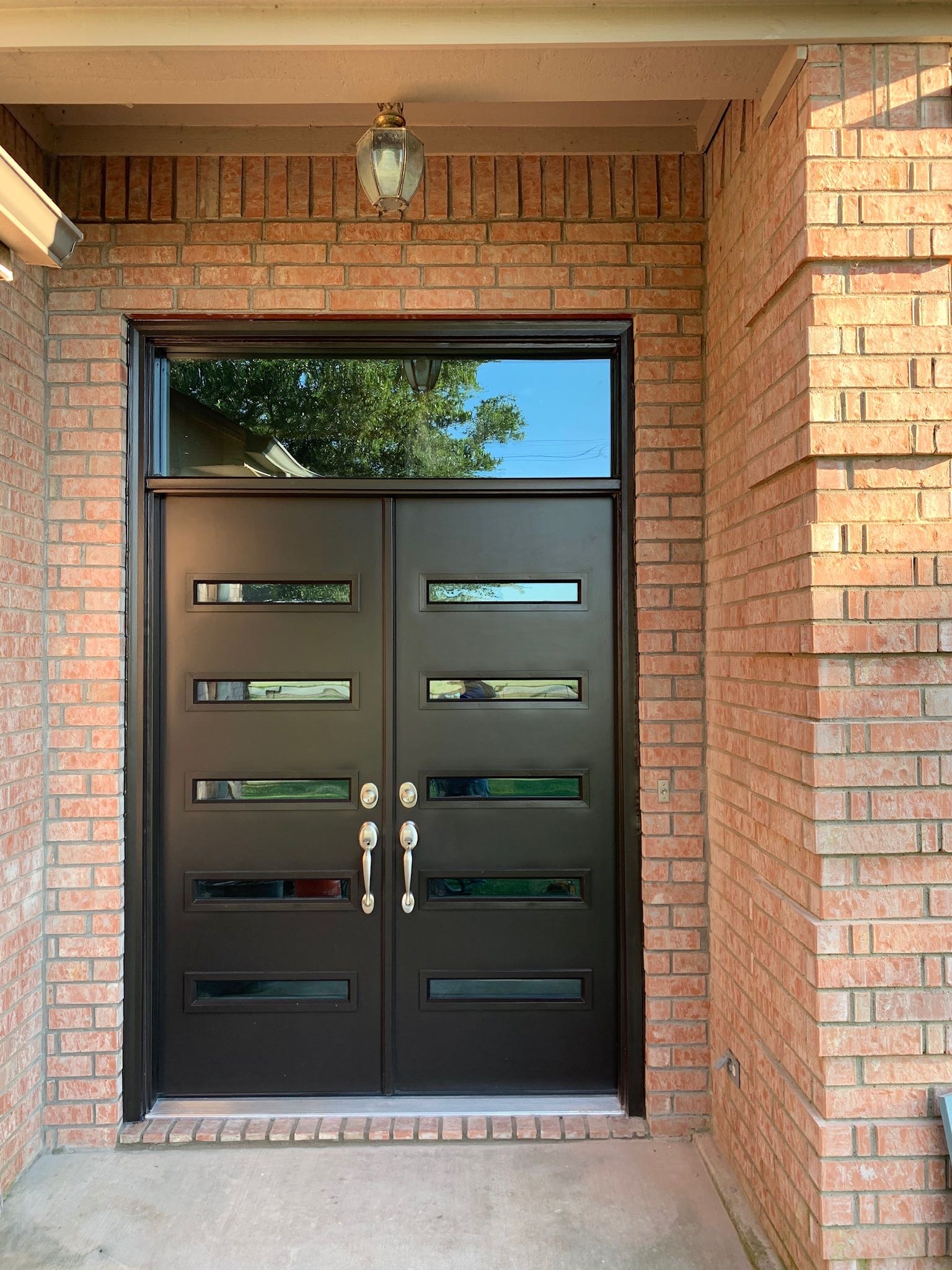Custom EcoView double entry doors with brick surround